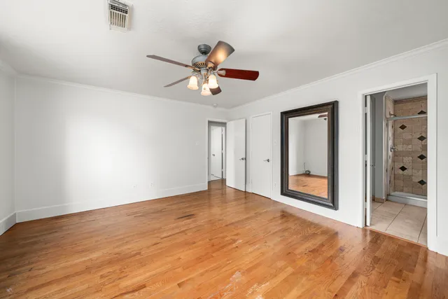 a view of an empty room with a bathroom