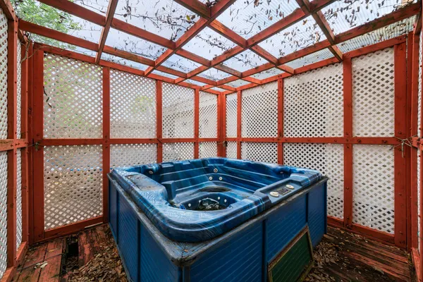 a blue kitchen with a stove and a large window