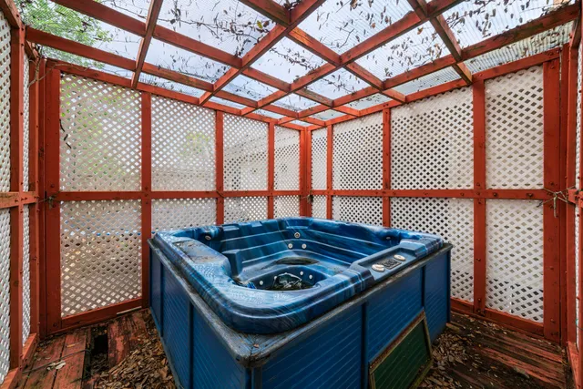 a blue kitchen with a stove and a large window