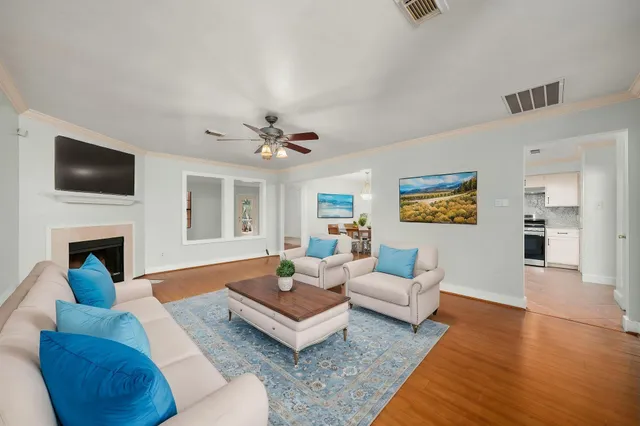 a living room with furniture fireplace and a flat screen tv