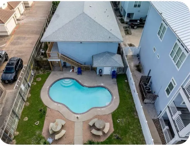 an aerial view of a house with swimming pool