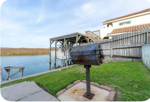 a view of swimming pool with seating space and roof deck