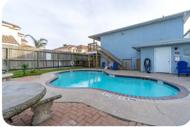 an aerial view of residential building with ocean view