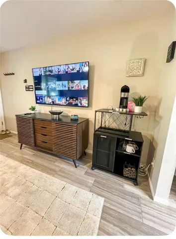 a bedroom with a bed and ceiling fan