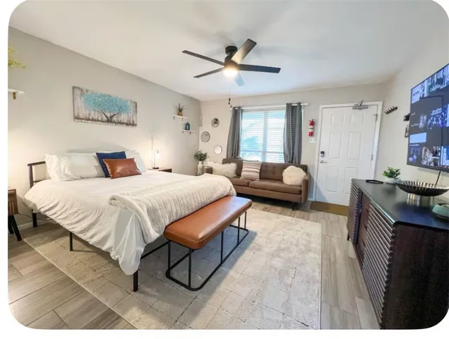 a bedroom with a bed and dresser