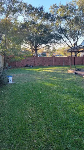 a view of outdoor space with deck and tree