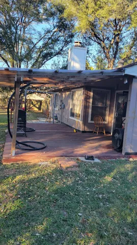a view of swimming pool with outdoor seating and yard