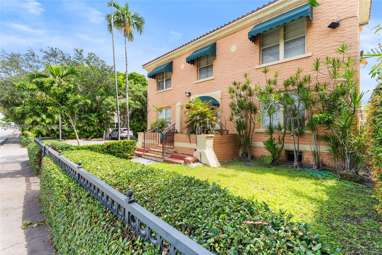 3409 South Le Jeune Road Coral Gables, FL 33134 - Photo 26 of 53 a front view of a house with garden