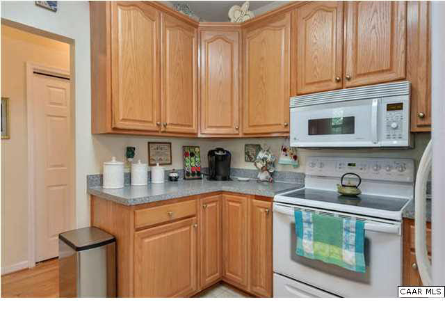 10 North Ridge Way Stanardsville, VA 22973 - Photo 12 of 25 This kitchen is open on both sides affording easy access from different parts of the home and offers lots of cabinet storage, too.