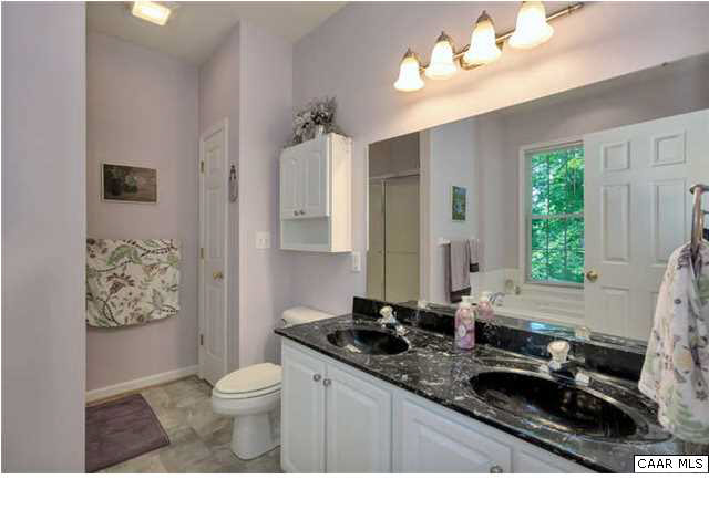 10 North Ridge Way Stanardsville, VA 22973 - Photo 15 of 25 Master bathroom en suite with double vanities in a neutral color for highlighting your own decorating tastes.