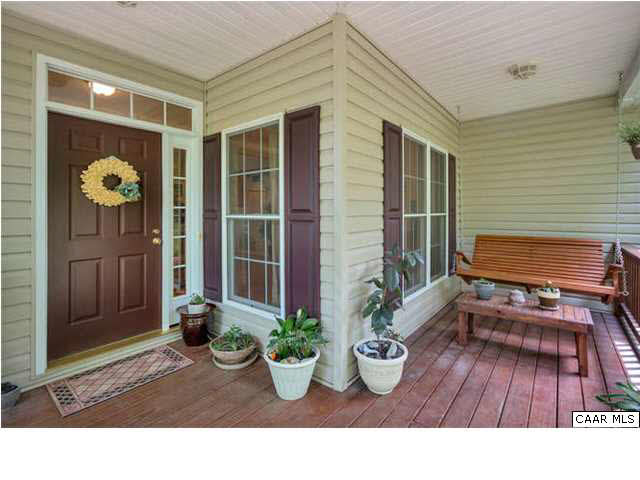 10 North Ridge Way Stanardsville, VA 22973 - Photo 2 of 25 Warm and inviting covered front porch sets the stage for greeting all your family, friends and guests. This spacious covered porch offers the perfect spot for sitting and sipping lemonade or reading a book.