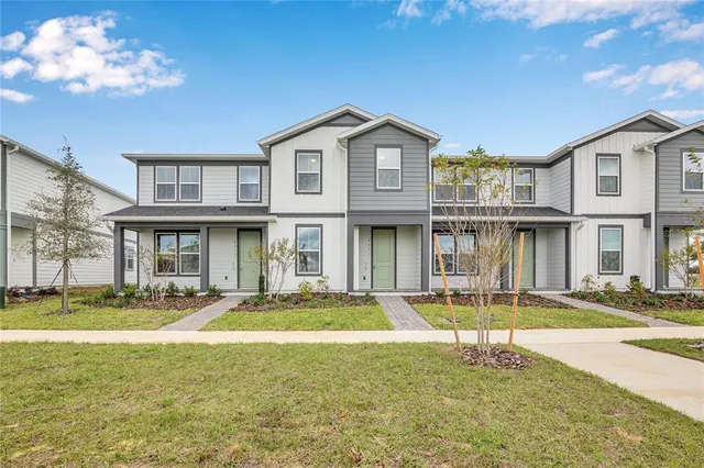 a front view of a building with a swimming pool