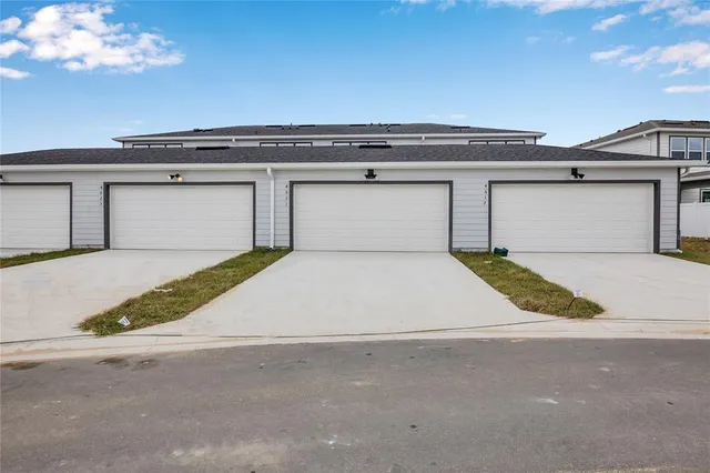 a view of garage and yard