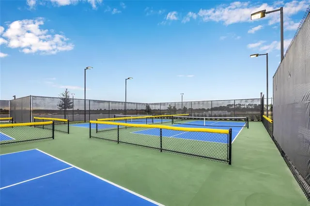 a view of a swimming pool with lawn chairs
