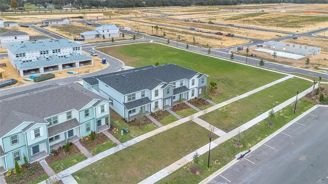 a view of a tennis court with a ocean view