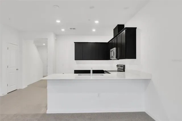 a large bathroom with a double vanity sink and mirror