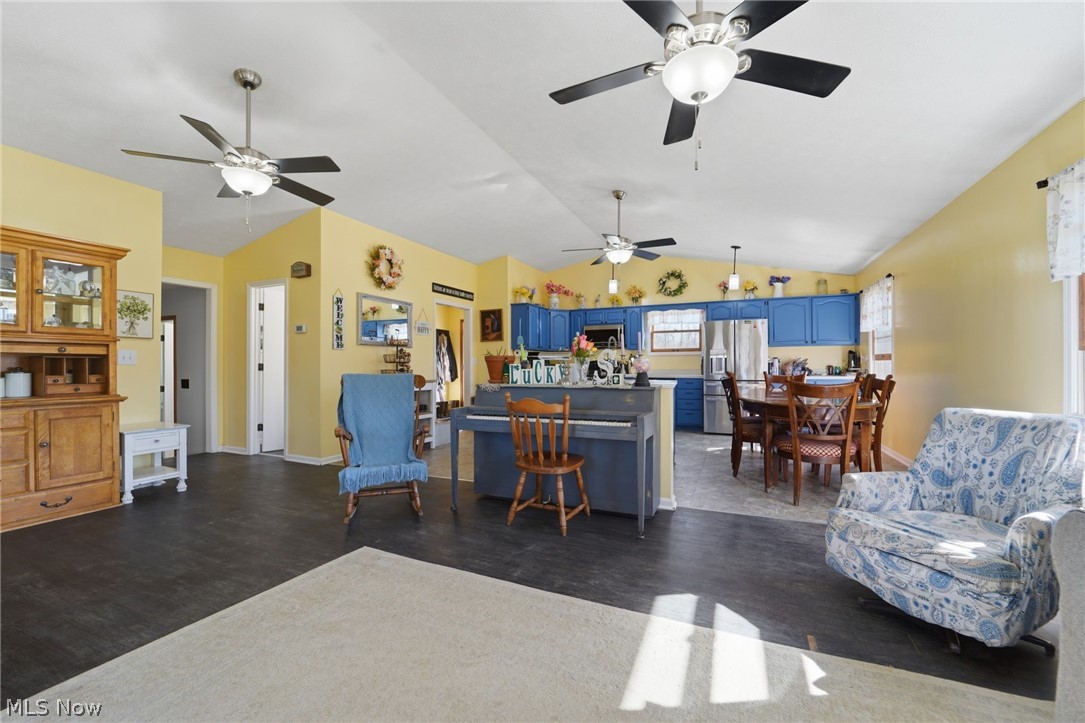 2932 Sexton Road Geneva, OH 44041 - Photo 10 of 41 Living room with vaulted ceiling, dark wood-style floors, and ceiling fan
