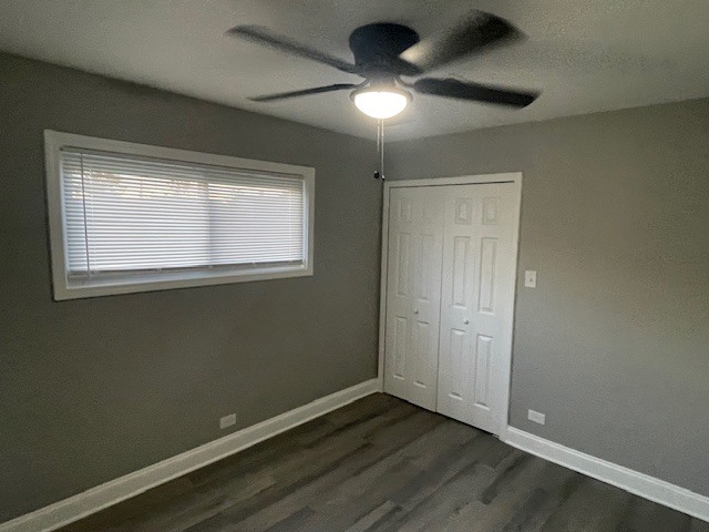 417 Hickory Street, Unit 2 Chicago Heights, IL 60411 - Photo 7 of 8 an empty room with a window and a fan