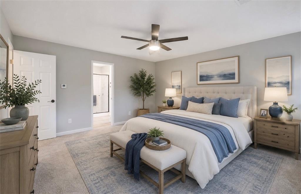 4110 Ridgebrook Bend Cumming, GA 30028 - Photo 27 of 49 a spacious bedroom with a bed and a potted plant