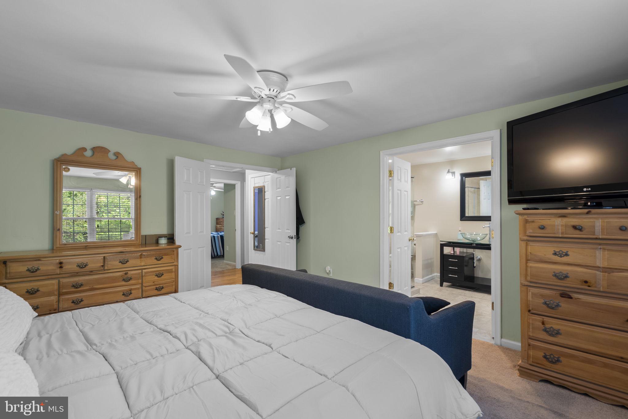 15048 Shamrock Ridge Road Silver Spring, MD 20906 - Photo 15 of 34 Cozy bedroom with ensuite charm.