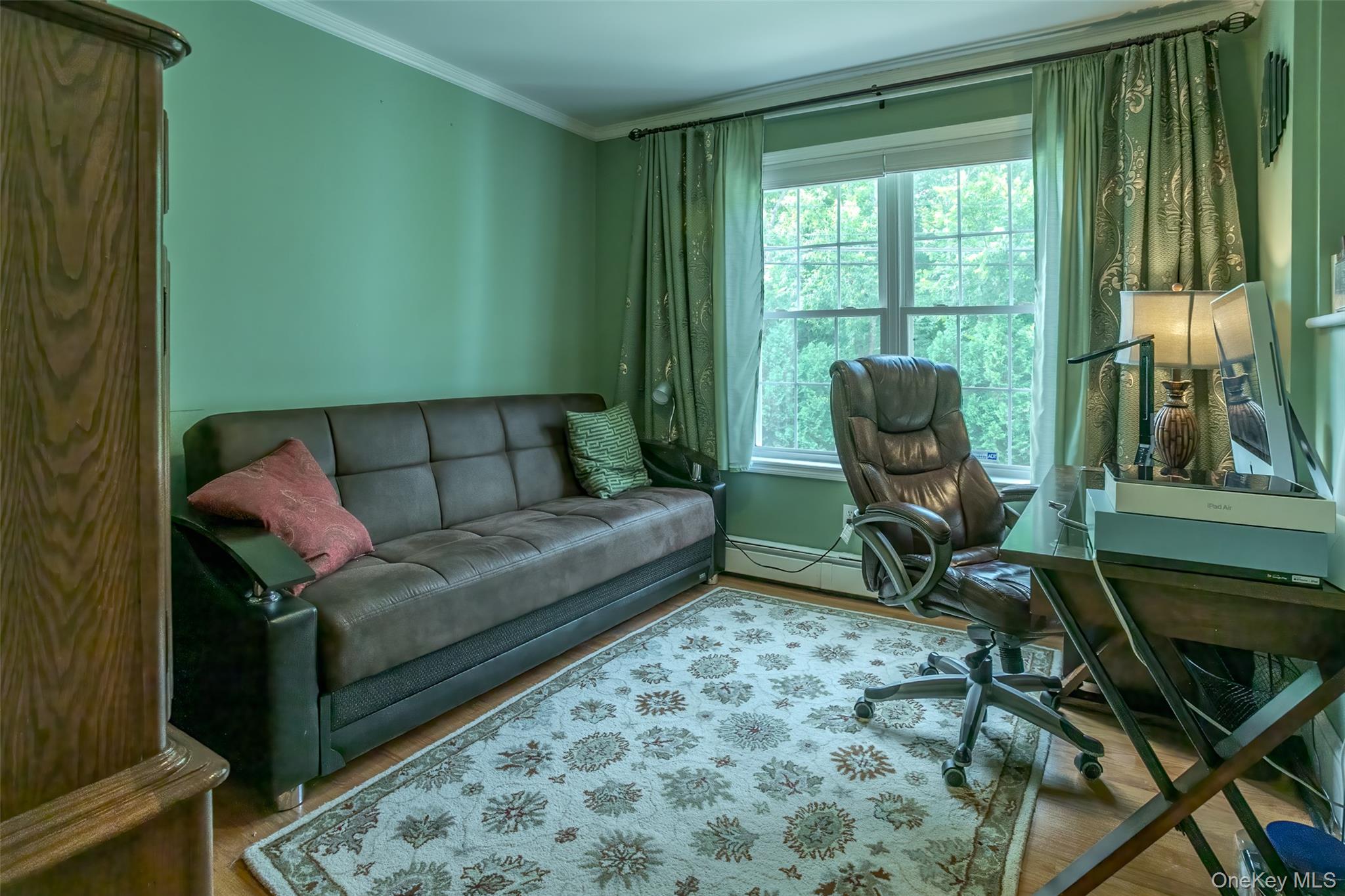 300 Mountain Lodge Road Monroe, NY 10950 - Photo 14 of 41 Home office featuring ornamental molding, wood finished floors, and a baseboard heating unit
