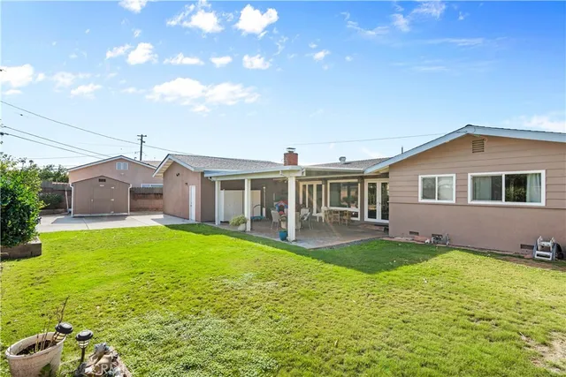 a front view of house with yard and patio