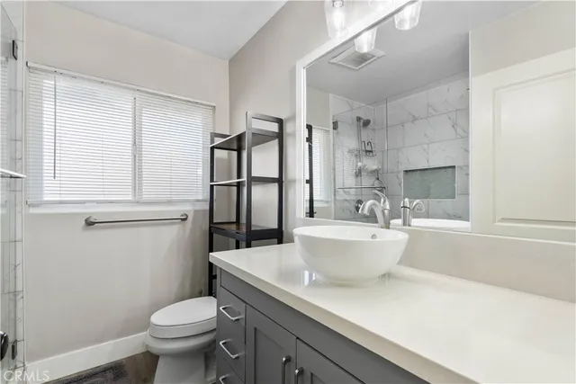 a white bath tub sitting next to a white toilet