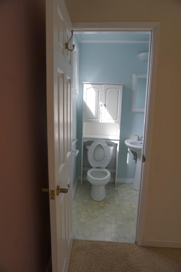 3090 Longview Drive San Bruno, CA 94066 - Photo 12 of 23 a bathroom with a toilet and a mirror
