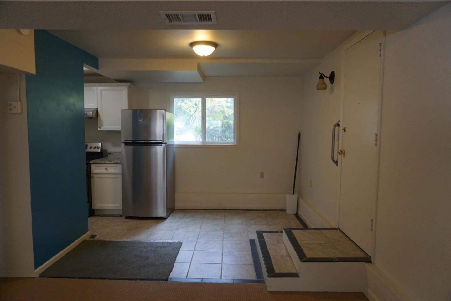 3090 Longview Drive San Bruno, CA 94066 - Photo 18 of 23 a view of a refrigerator in kitchen and an empty room