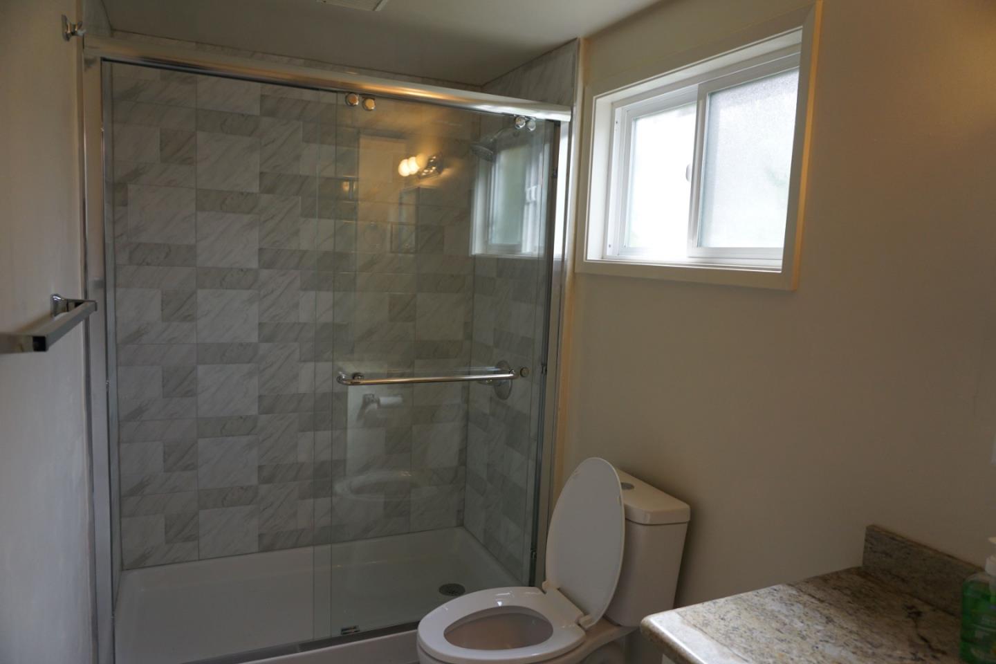 3090 Longview Drive San Bruno, CA 94066 - Photo 22 of 23 a bathroom with a shower and toilet