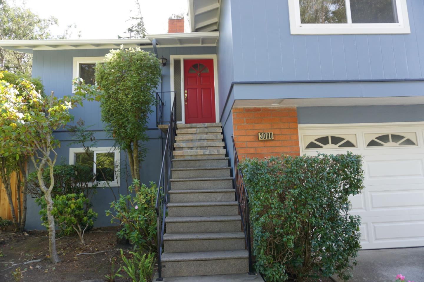3090 Longview Drive San Bruno, CA 94066 - Photo 3 of 23 a view of a pathway of a house with potted plants