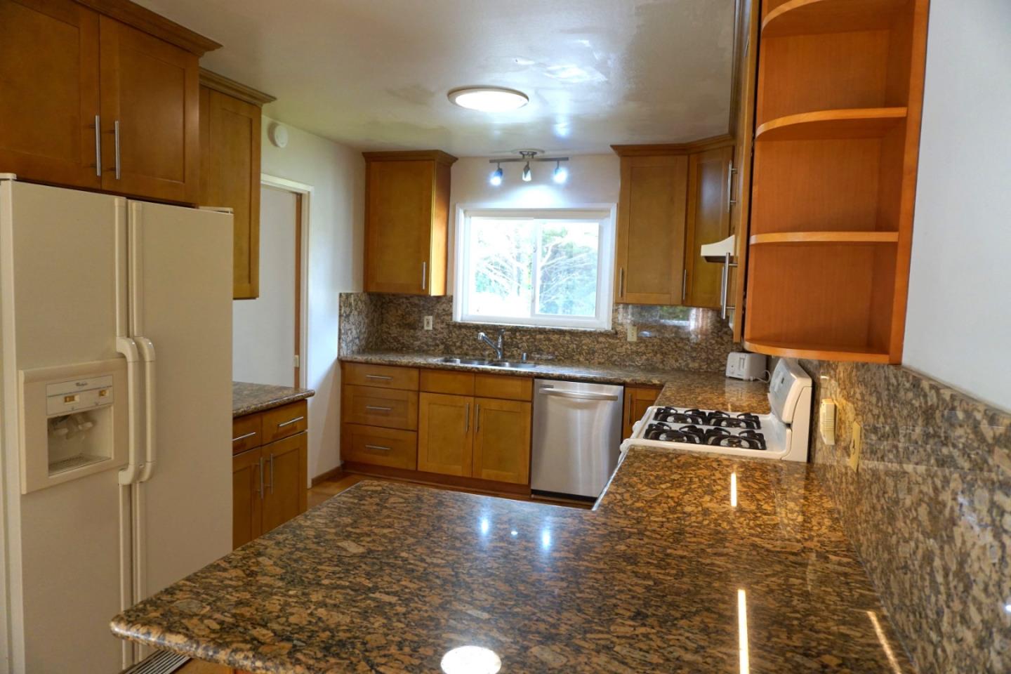 3090 Longview Drive San Bruno, CA 94066 - Photo 6 of 23 a kitchen with a refrigerator sink and cabinets
