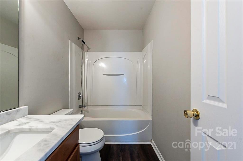 2759 Rustic Ridge Court Rock Hill, SC 29730 - Photo 14 of 19 a bathroom with a granite countertop sink toilet and shower