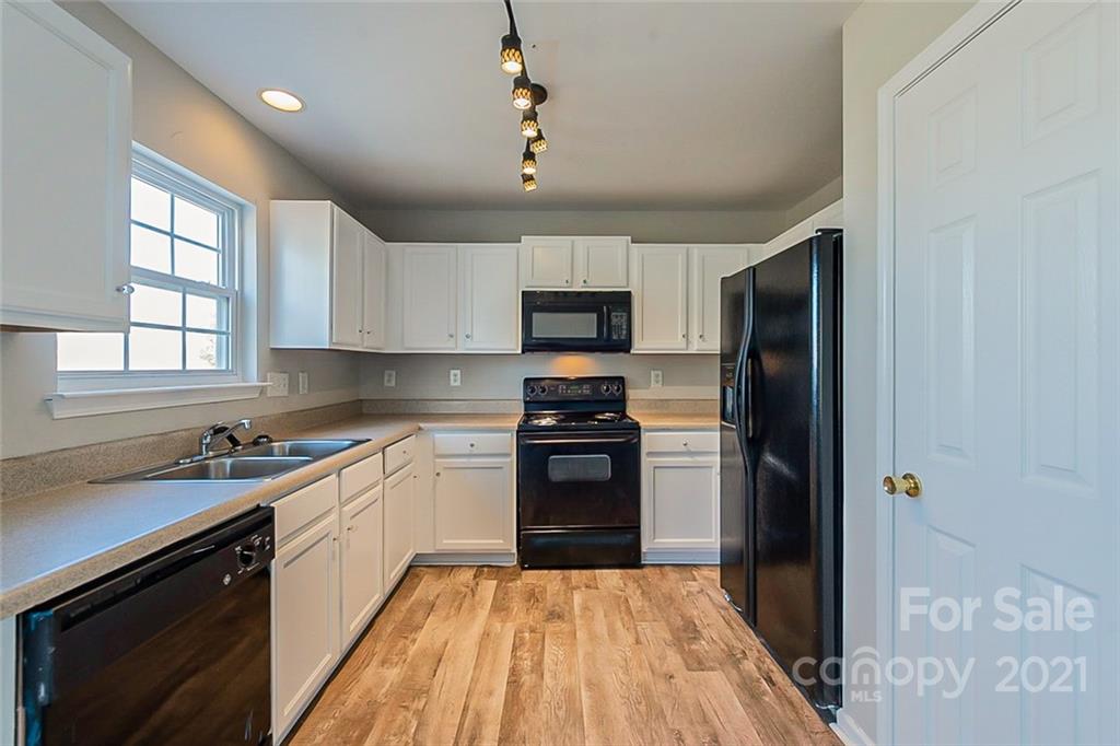 2759 Rustic Ridge Court Rock Hill, SC 29730 - Photo 4 of 19 a kitchen with a refrigerator stove and microwave