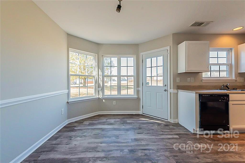 2759 Rustic Ridge Court Rock Hill, SC 29730 - Photo 6 of 19 a view of an empty room with a window and wooden floor