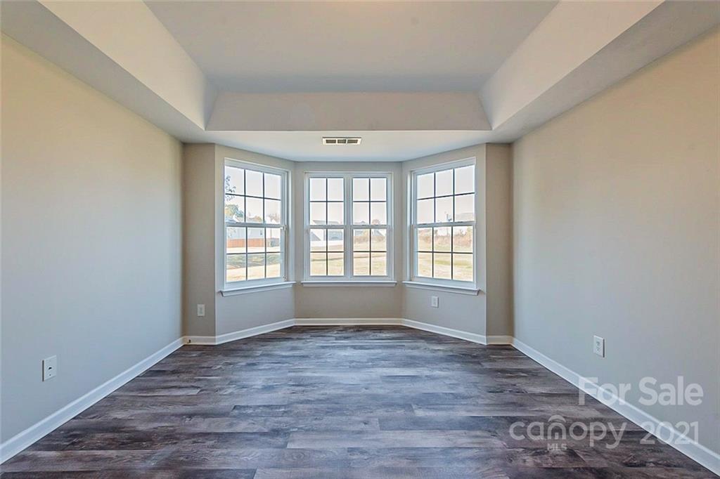 2759 Rustic Ridge Court Rock Hill, SC 29730 - Photo 8 of 19 a view of an empty room with wooden floor and a window