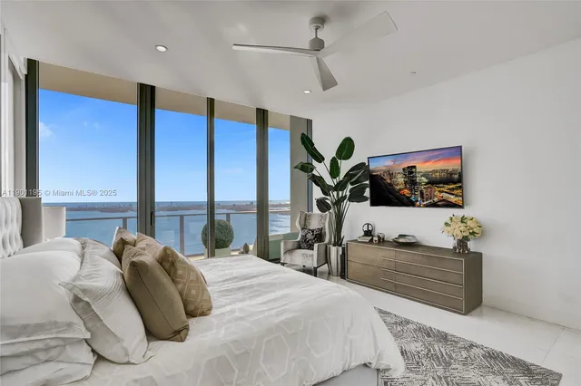 a bedroom with a bed and a mirror