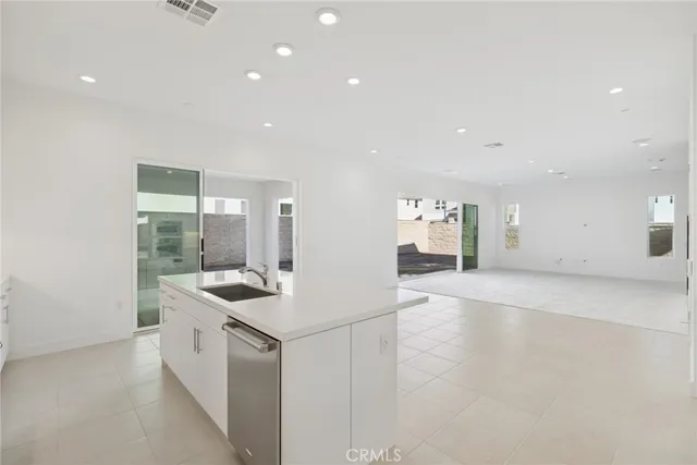 a kitchen with a sink and stove