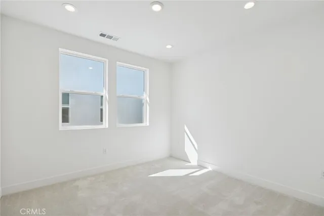 a bathroom with a sink toilet vanity and tub