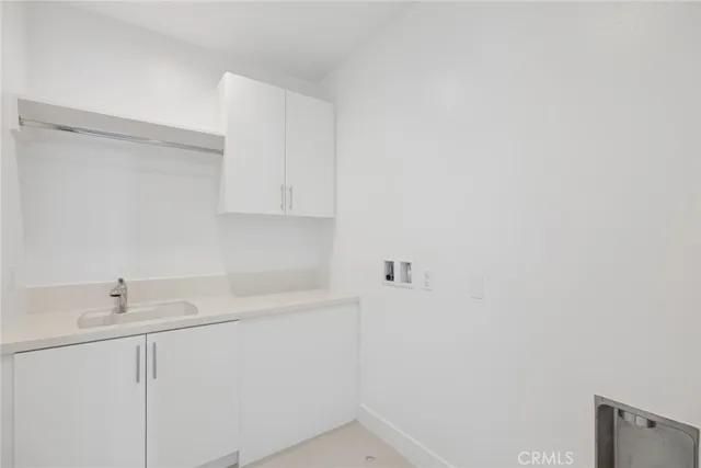 an outdoor sitting area with couch and garden view