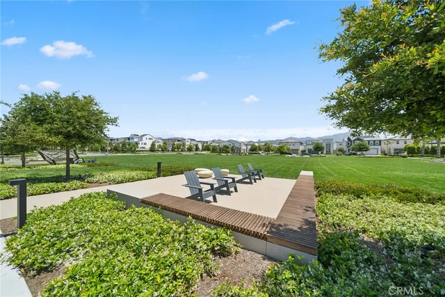 a view of a backyard with sitting area