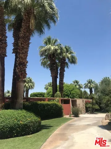 a swimming pool with wooden fence