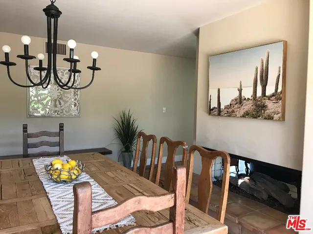 a view of a livingroom with furniture wooden floor and windows