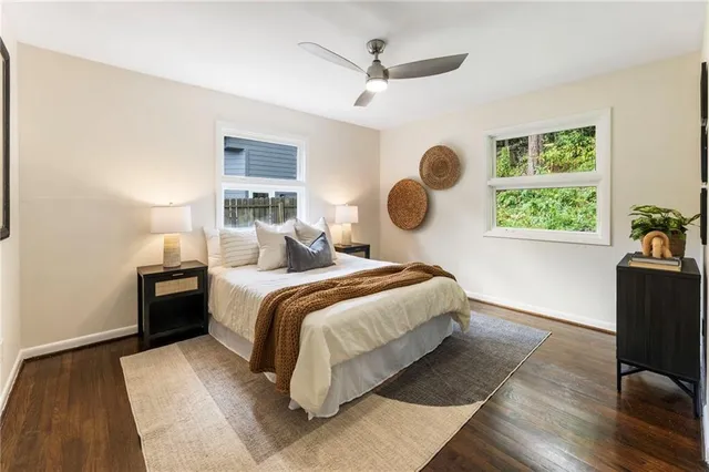 a bedroom with a large bed and a window