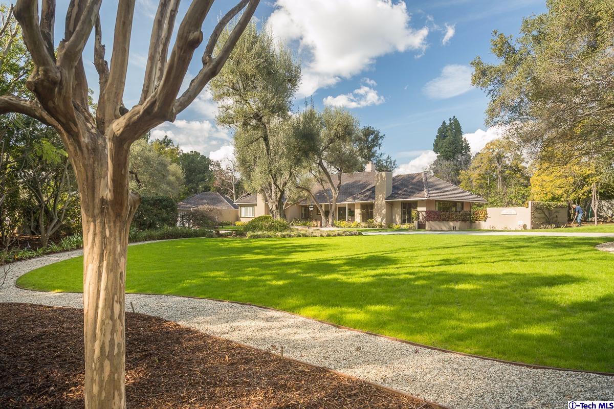 1 Oak Knoll Terrace Pasadena, CA 91106 - Photo 17 of 88 a front view of a house with a yard table and chairs