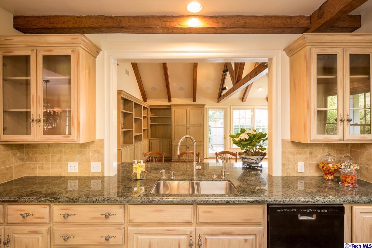 1 Oak Knoll Terrace Pasadena, CA 91106 - Photo 43 of 88 a kitchen with a granite countertop sink and window