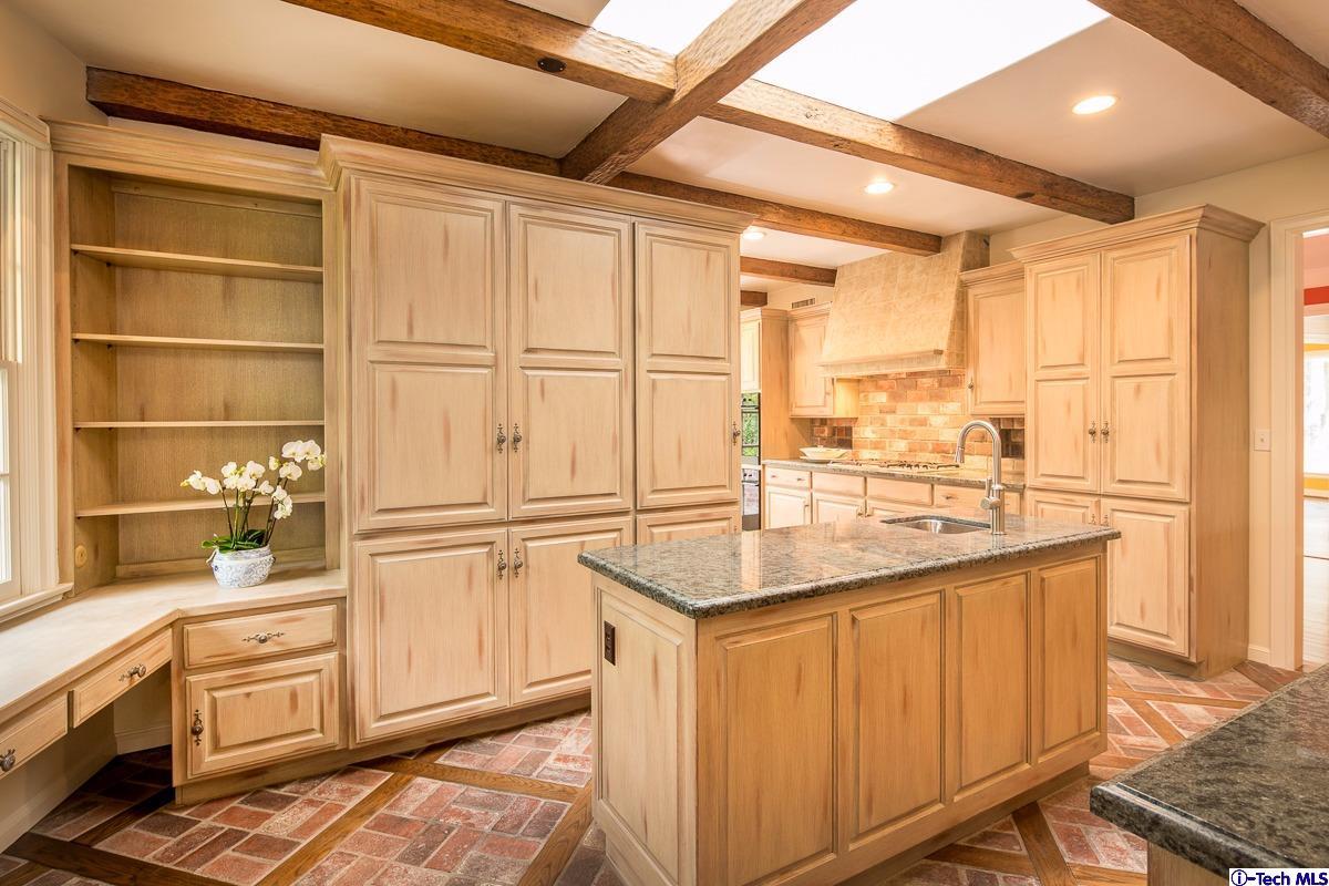 1 Oak Knoll Terrace Pasadena, CA 91106 - Photo 44 of 88 a kitchen with a sink stove and cabinets