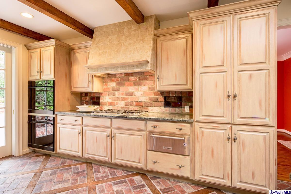1 Oak Knoll Terrace Pasadena, CA 91106 - Photo 45 of 88 a kitchen with stainless steel appliances granite countertop a stove a sink and a refrigerator