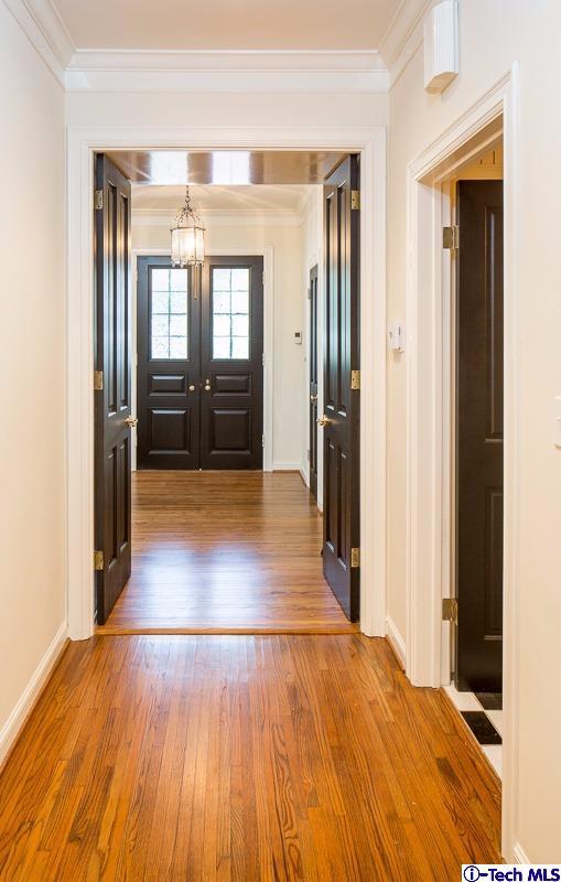 1 Oak Knoll Terrace Pasadena, CA 91106 - Photo 60 of 88 a view of a hallway with wooden floor and windows