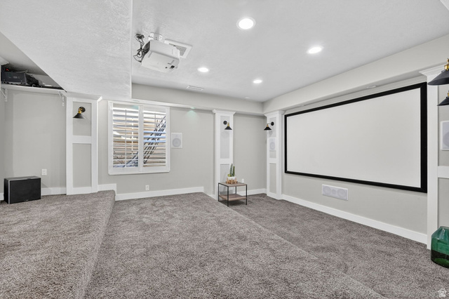 14714 South Bright Wood Road Herriman, UT 84096 - Photo 35 of 41 Home theater room featuring carpet, theater lighting, screen and projector